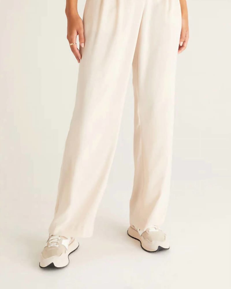 Front of a model wearing a size L Lucy Twill Pants in Ivory in Ivory by Z Supply. | dia_product_style_image_id:343231